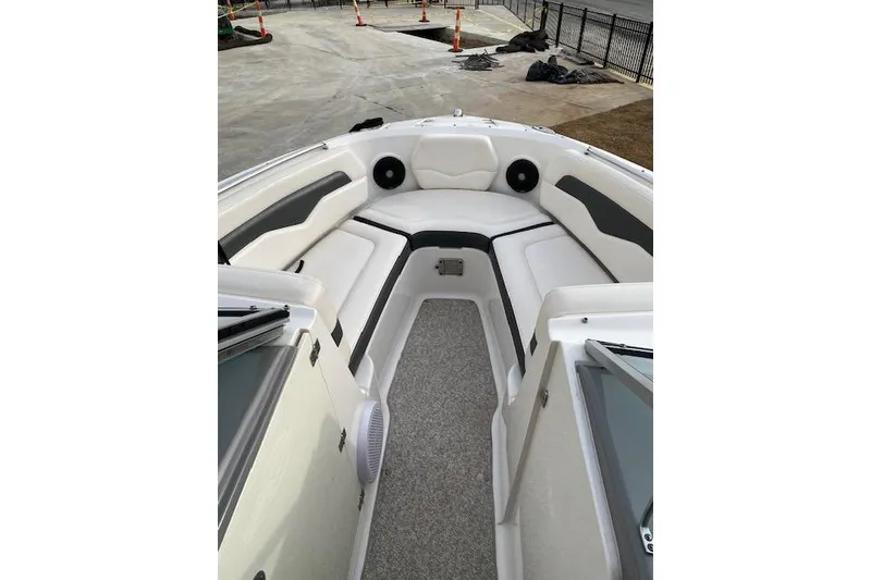 Slide: The Image of 2013 Chaparral 226 SSi boat interior with white seating and gray accents. - 9