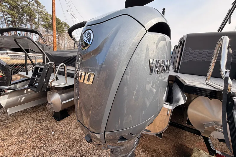 Slide: The Image of 2026 Veranda VR 235 RC boat with Yamaha outboard motor, parked outdoors. - 15