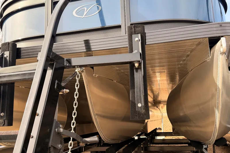 Slide: The Image of 2026 Veranda VR 235 RC pontoon boat underside view with trailer details. - 2