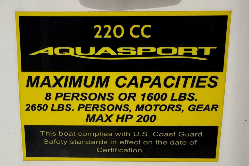 Slide: The Image of 2024 Aquasport 2200 Center Console capacity label, 8 persons, 1600 lbs, max HP 200. - 15