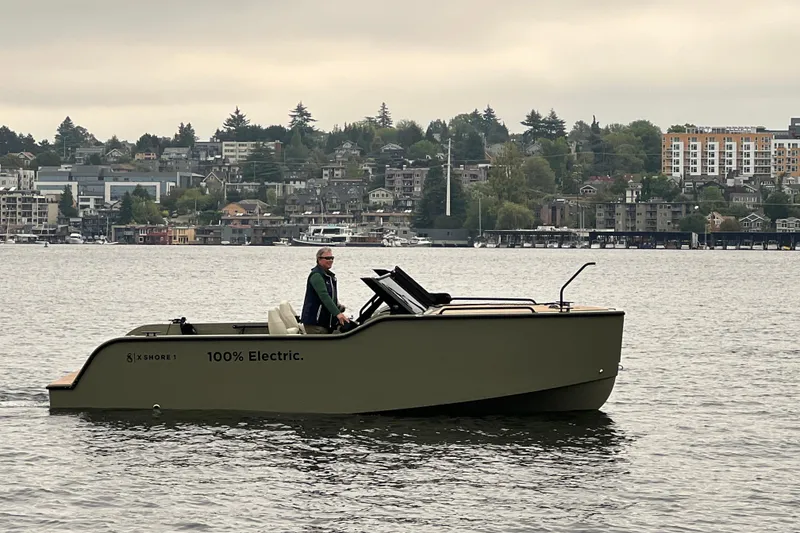The Image of 2024 X Shore 1 electric boat cruising on Lake Union  with cityscape background. - 0