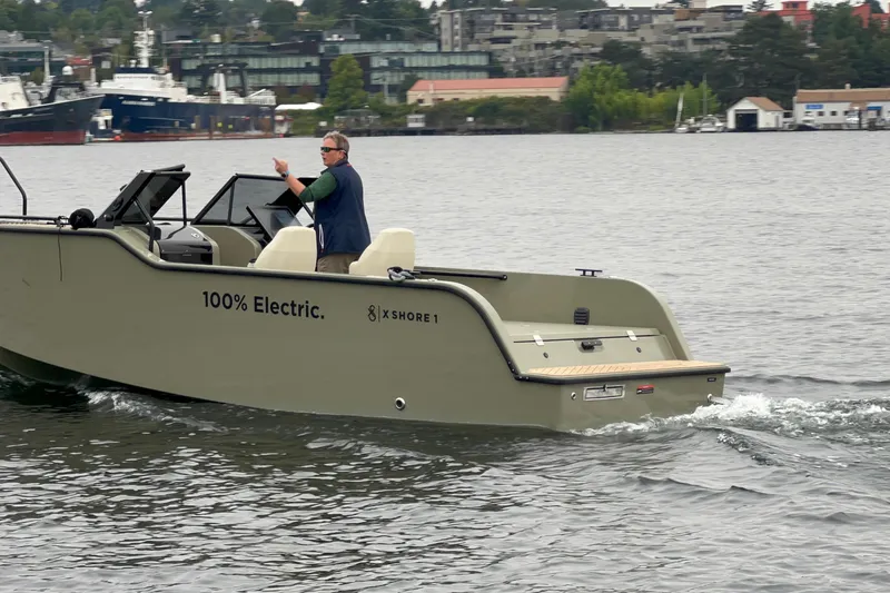 Slide: The Image of 2024 X Shore 1 electric boat cruising on water, showcasing eco-friendly design. - 8