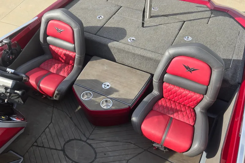 Slide: The Image of 2020 Vexus VX20 boat interior with red and black seats, center console, and cup holders. - 13