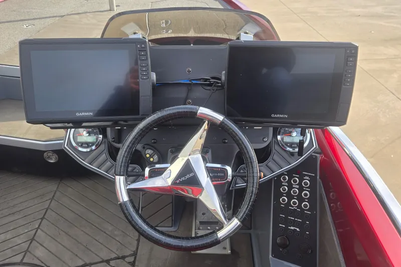 Slide: The Image of 2020 Vexus VX20 boat dashboard with dual Garmin displays and steering wheel. - 5
