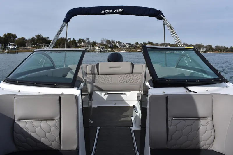 Slide: The Image of 2022 Four Winns H2 OB boat interior with gray seating and open water view. - 18
