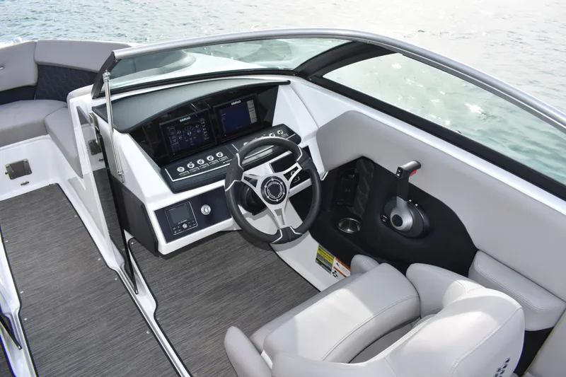 Slide: The Image of 2022 Four Winns H2 OB boat interior with modern dashboard and steering wheel. - 19