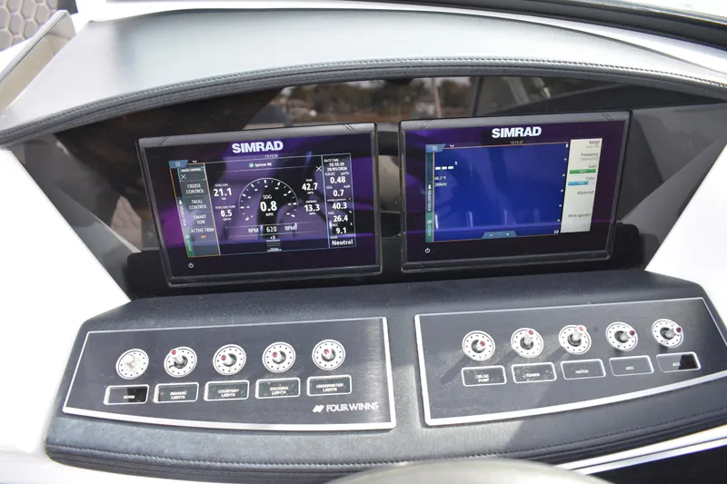 Slide: The Image of Dashboard of 2022 Four Winns H2 OB boat with Simrad displays and control panel. - 22