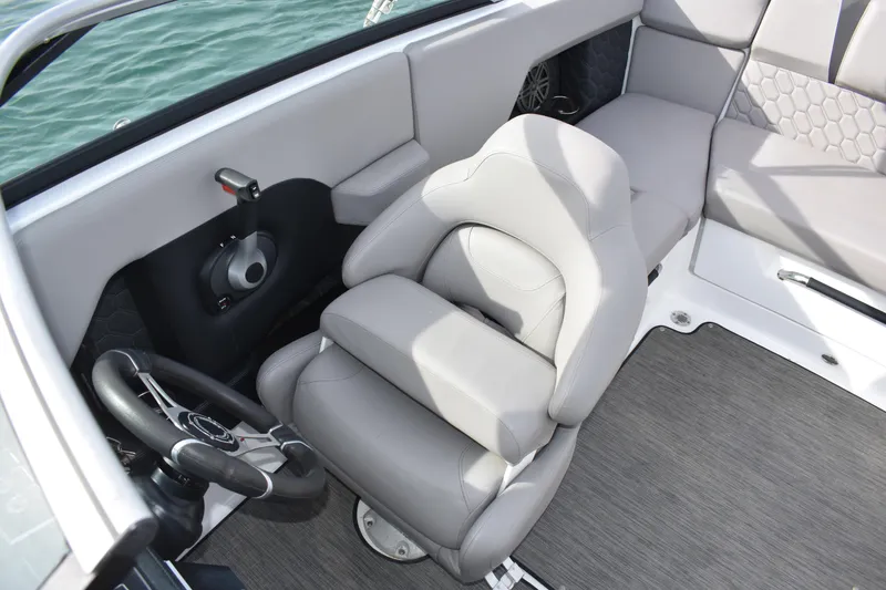 Slide: The Image of 2022 Four Winns H2 OB boat interior with gray seating and steering wheel. - 24