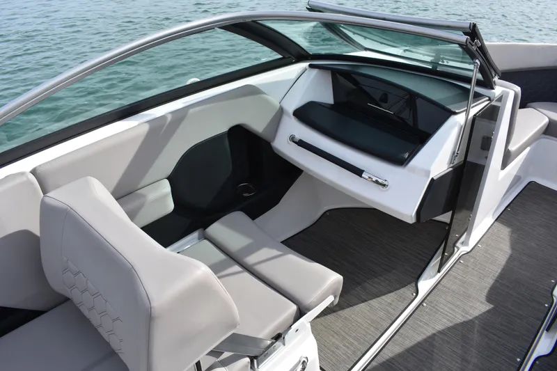 Slide: The Image of 2022 Four Winns H2 OB boat interior with sleek seating and modern dashboard design. - 27