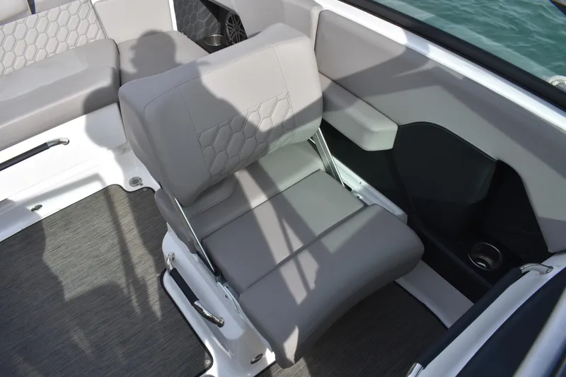 Slide: The Image of 2022 Four Winns H2 OB boat interior with gray seating and modern design. - 28