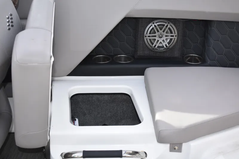 Slide: The Image of 2022 Four Winns H2 OB boat interior with speaker and cup holders. - 32