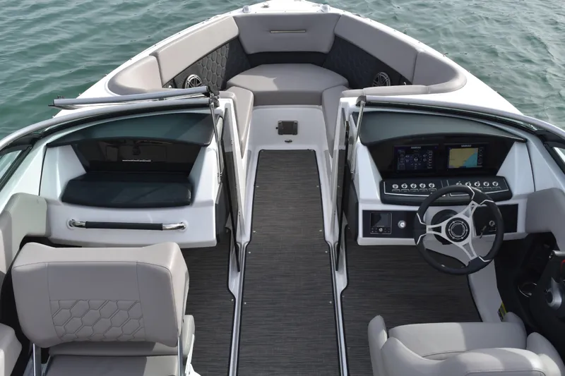 Slide: The Image of 2022 Four Winns H2 OB boat interior with modern dashboard and seating. - 38