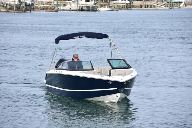 Slide: The Image of 2022 Four Winns H2 OB boat cruising on calm water. - 9