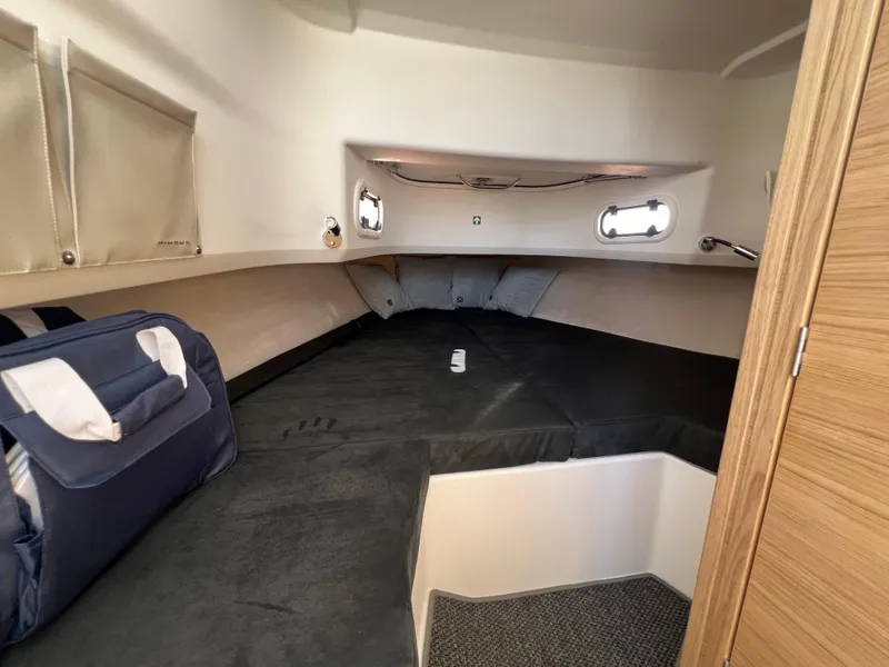 Slide: The Image of Cozy cabin interior of 2024 Nimbus T9 boat with comfortable bedding and storage. - 17