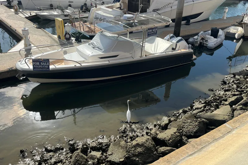Slide: The Image of 2024 Nimbus T9 boat for sale at marina, with heron nearby. - 26