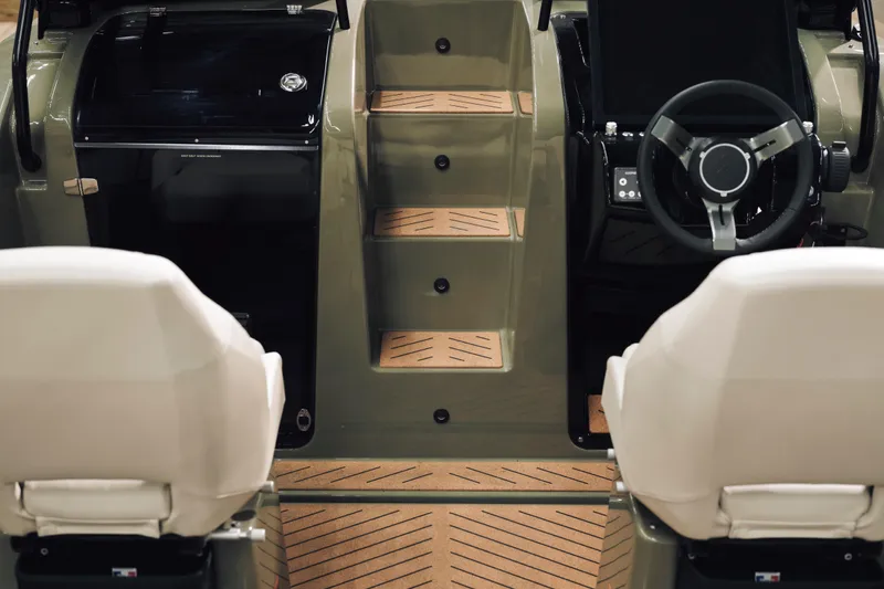 Slide: The Image of Interior of 2024 X Shore 1 boat, featuring modern helm and seating. - 10