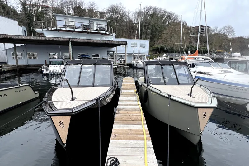 Slide: The Image of 2024 X Shore 1 electric boats docked at Signature Yachts, showcasing modern design and eco-friendly technology. - 4