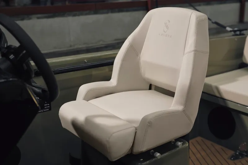 Slide: The Image of 2024 X Shore 1 boat seat, featuring sleek design and comfortable beige upholstery. - 7