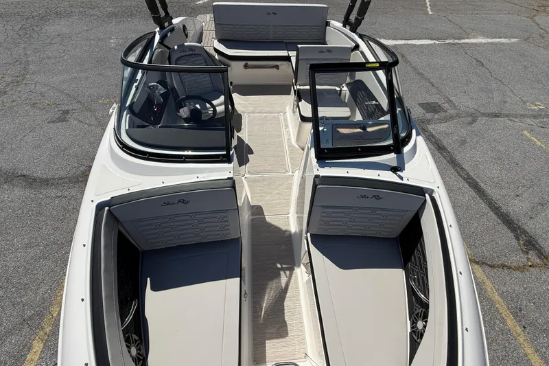 Slide: The Image of 2026 Sea Ray SPX 210 boat interior with seating and steering wheel, viewed from above. - 13