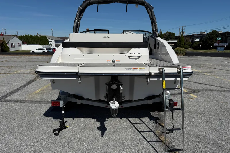 Slide: The Image of 2026 Sea Ray SPX 210 boat rear view with swim platform and ladder. - 3