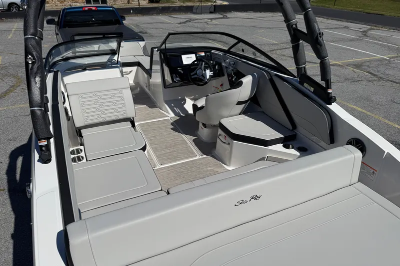 Slide: The Image of 2026 Sea Ray SPX 210 boat interior with sleek seating and modern dashboard design. - 5
