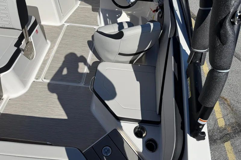 Slide: The Image of Interior of 2026 Sea Ray SPX 210 boat with seating and cup holders. - 7