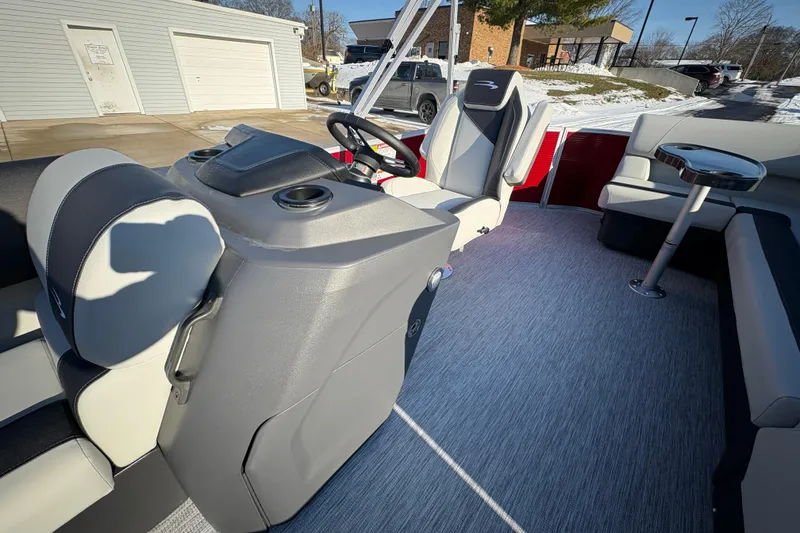 Slide: The Image of 2026 Bennington 20 SL pontoon boat interior with modern seating and steering console. - 12