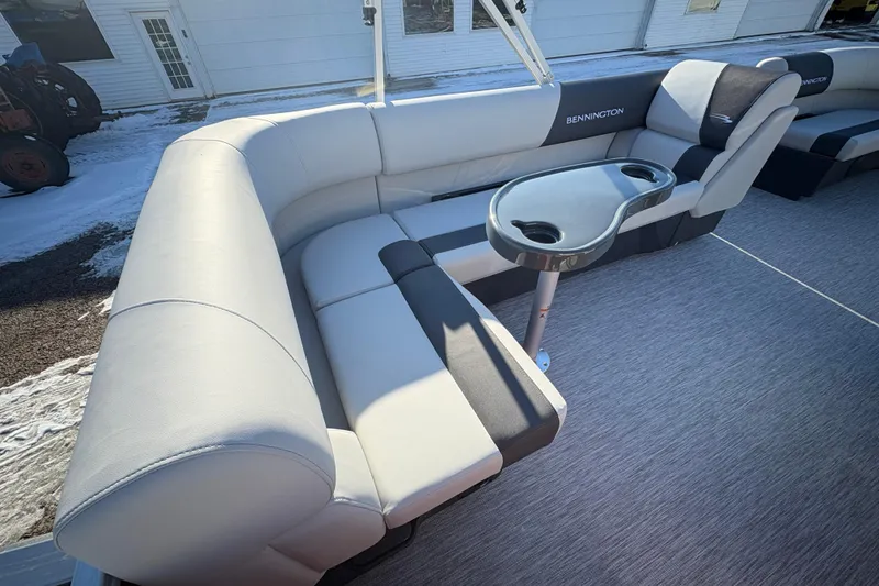 Slide: The Image of 2026 Bennington 20 SL pontoon boat interior with plush seating and cup holders. - 19