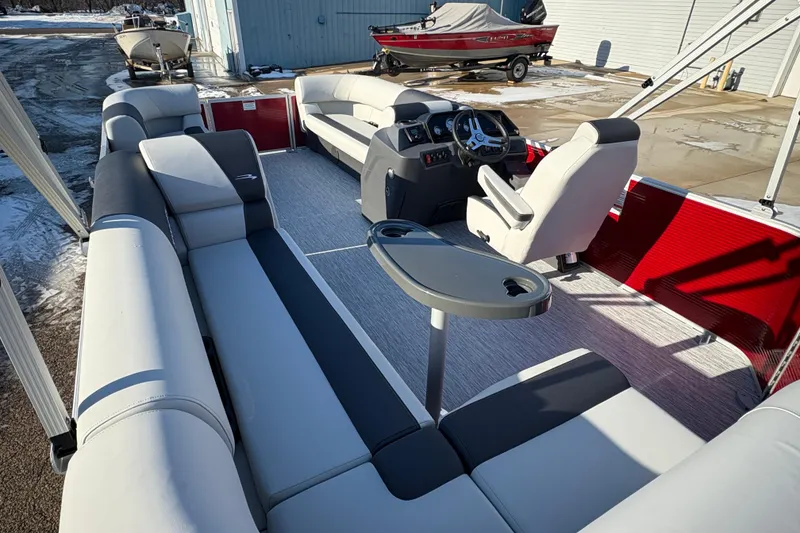 Slide: The Image of 2026 Bennington 20 SL pontoon boat interior with modern seating and steering console. - 22