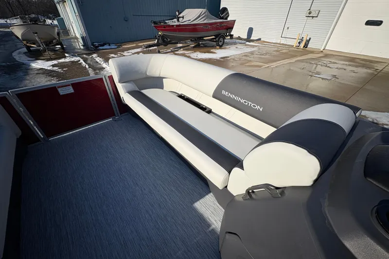 Slide: The Image of 2026 Bennington 20 SL boat interior with sleek seating and modern design. - 8