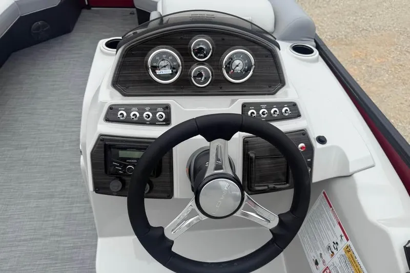 Slide: The Image of 2026 Lowe SS 230 WV boat dashboard with steering wheel and control panel. - 10