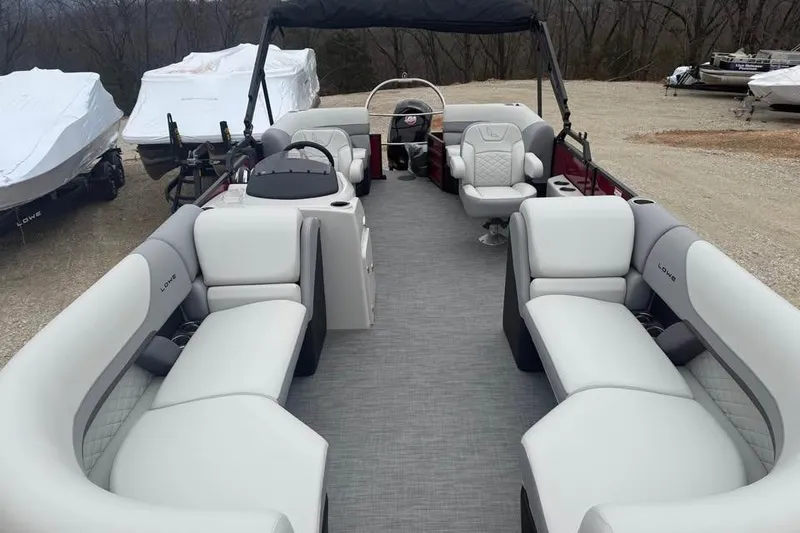 Slide: The Image of 2026 Lowe SS 230 WV pontoon boat with spacious seating and modern design. - 13