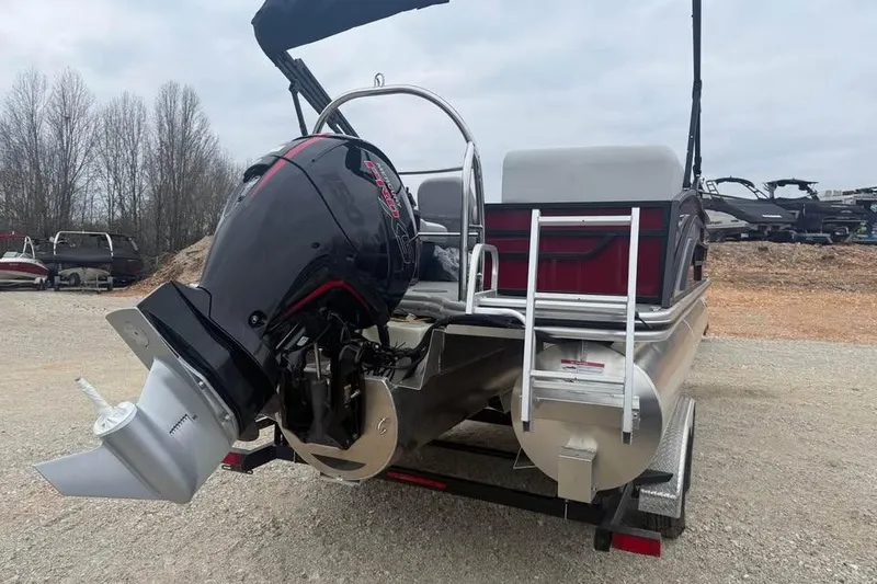 Slide: The Image of 2026 Lowe SS 230 WV pontoon boat with powerful outboard motor, parked on trailer. - 5