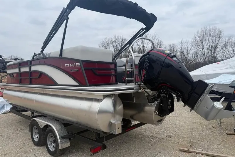 Slide: The Image of 2026 Lowe SS 230 WV pontoon boat on trailer with outboard motor. - 7
