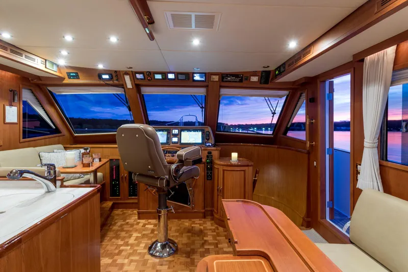 Slide: The Image of Luxurious 2006 Grand Banks 59 Aleutian RP yacht interior with sunset view. - 11