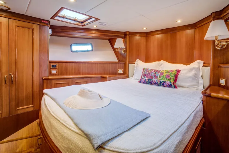 Slide: The Image of Luxurious cabin interior of 2006 Grand Banks 59 Aleutian RP yacht with wood paneling. - 22