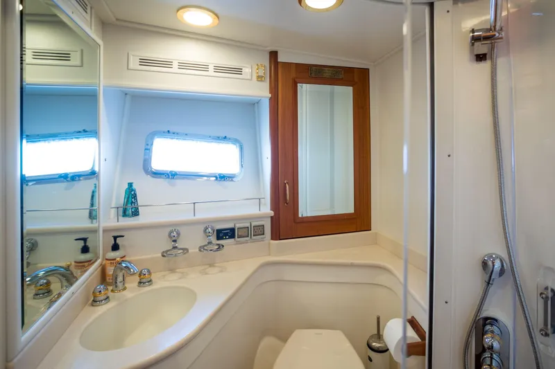 Slide: The Image of Luxurious bathroom in 2006 Grand Banks 59 Aleutian RP yacht with modern fixtures. - 24