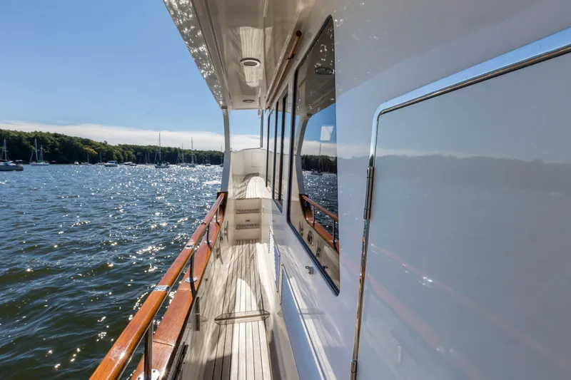 Slide: The Image of Side deck of 2006 Grand Banks 59 Aleutian RP yacht on a sunny day. - 26