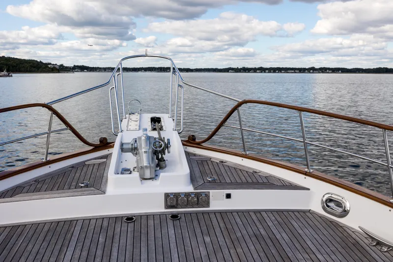 Slide: The Image of Bow view of 2006 Grand Banks 59 Aleutian RP yacht on calm water. - 32
