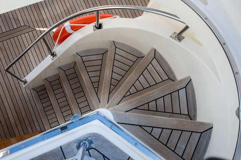 Slide: The Image of Spiral staircase on 2006 Grand Banks 59 Aleutian RP yacht with wooden steps and railing. - 34