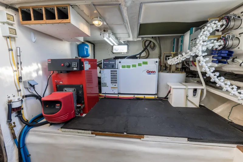 Slide: The Image of Engine room of 2006 Grand Banks 59 Aleutian RP yacht with generator and equipment. - 44