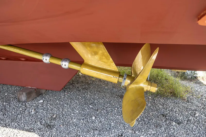 Slide: The Image of Propeller of 2006 Grand Banks 59 Aleutian RP yacht on gravel surface. - 47
