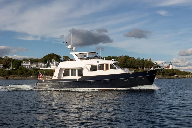 Slide: The Image of 2006 Grand Banks 59 Aleutian RP yacht cruising on a scenic waterway. - 53