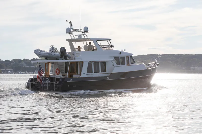 Slide: The Image of 2006 Grand Banks 59 Aleutian RP yacht cruising on a sunny day. - 56