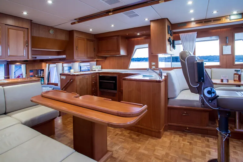 Slide: The Image of Luxurious interior of 2006 Grand Banks 59 Aleutian RP yacht with wood finishes and seating. - 7