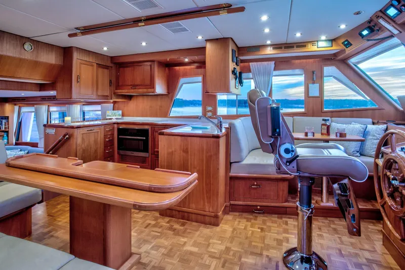 Slide: The Image of Luxurious interior of 2006 Grand Banks 59 Aleutian RP yacht with wood finishes and seating. - 8