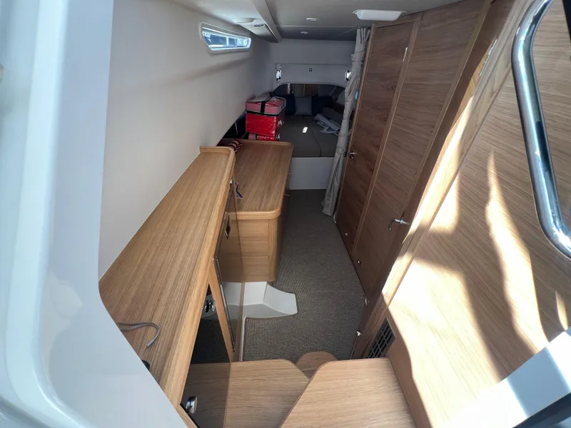 Slide: The Image of Interior of 2024 Nimbus T11 boat with wooden cabinetry and modern design. - 17