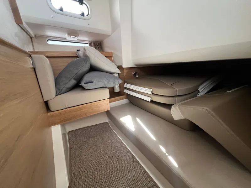 Slide: The Image of Interior of 2024 Nimbus T11 boat with cushioned seating and modern design. - 20