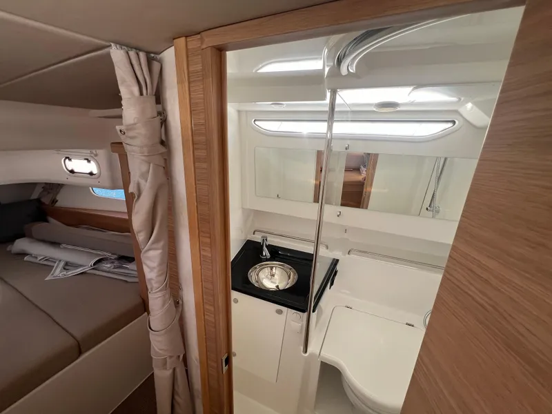 Slide: The Image of Luxurious 2024 Nimbus T11 yacht interior with modern bathroom and cozy bedroom. - 22