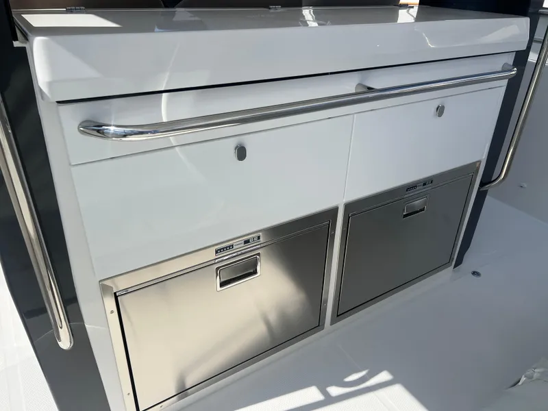 Slide: The Image of 2024 Nimbus T11 boat kitchen with stainless steel drawers and sleek design. - 4